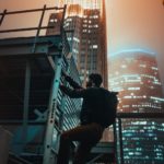 A man climbing ladders in the city, symbolizing the journey of reaching a distant goal through determination and perseverance.