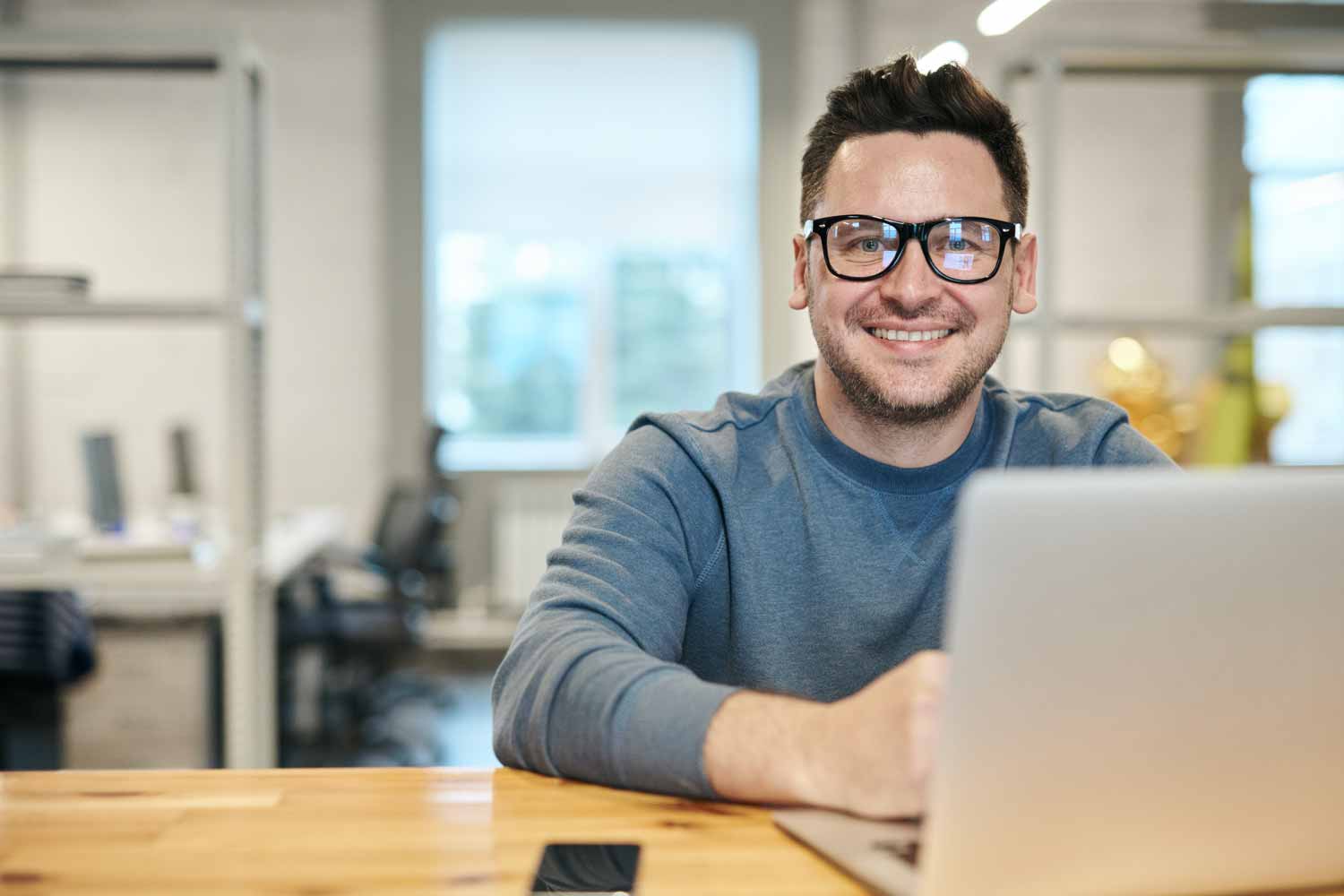 What Successful People Do Every Monday? A man sitting at a desk with a laptop